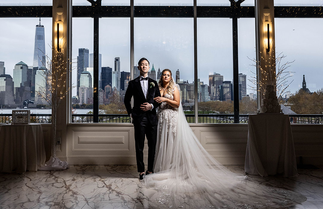 Liberty House couple posing in front of cityscape
