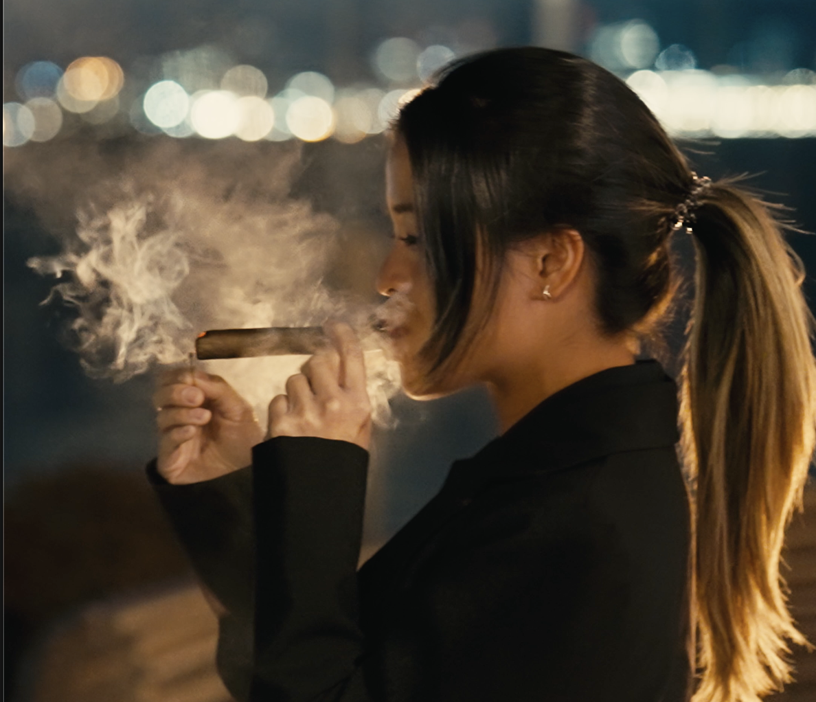 woman smoking cigars